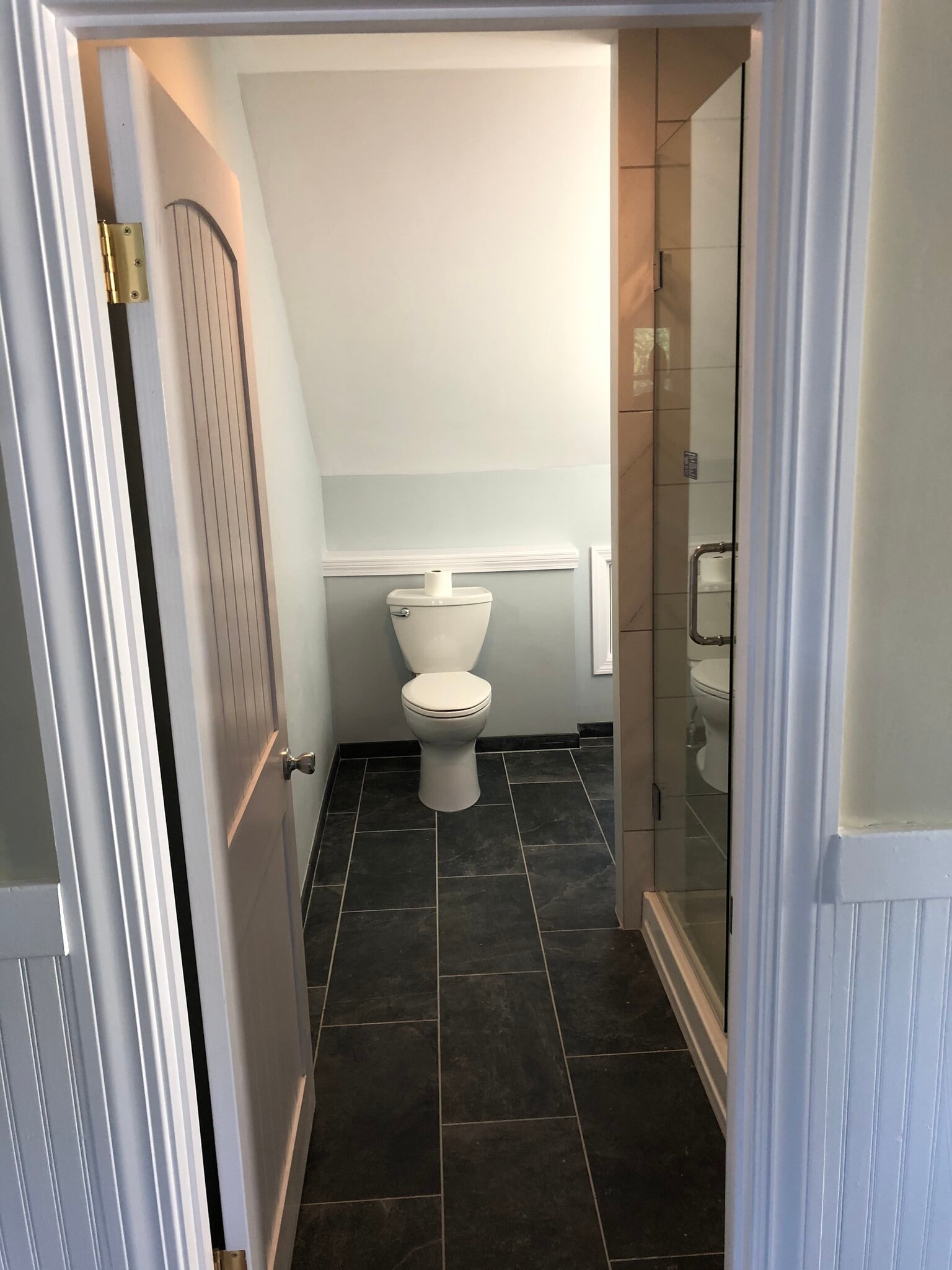 Bathroom w/ fan and heater. Shelf behind toilet can be used functionally or for decorations. - 16 Tecumseh Street