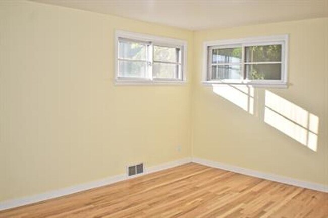 Building Photo - Updated house with original hardwoods and 2-car garage!