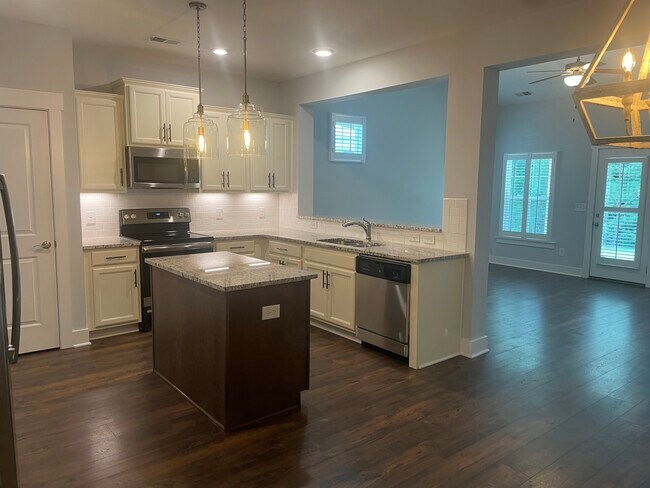 Kitchen open to the Vaulted Family Room - 5100 Gracious Drive