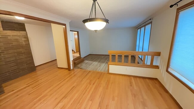 Building Photo - 4bd/3ba HUGE Home w/Hardwood Floors, Russian Fireplace, 2-Car Garage & Fenced Back Yard!