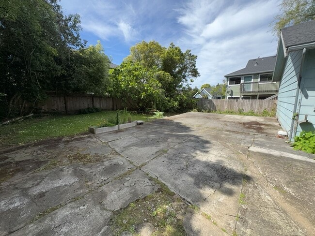 Building Photo - Sit out with your pet on the patio of this...