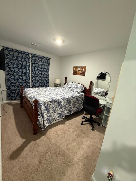 Guest bedroom. Queen bed shown - 141 Rosefield Ct