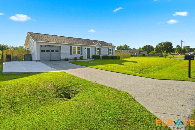 Building Photo - Beautiful Like-New 3 Bedroom Home with Huge Fenced Yard, Greenhouse & Storage
