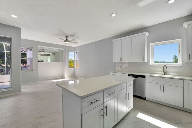 Building Photo - A BOATER'S PARADISE WITH THIS STUNNING 3 BEDROOM, 2 BATH WATERFRONT POOL HOME W/DOCK & BOAT LIFT ...