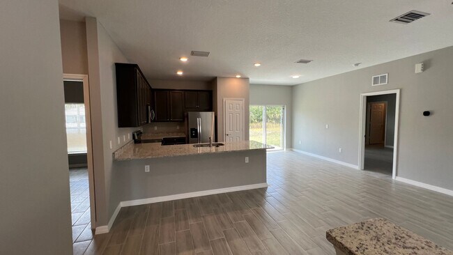 Building Photo - Smart & Stylish 3BD/2BA Palm Bay Home – Modern Upgrades, No Water Bills!