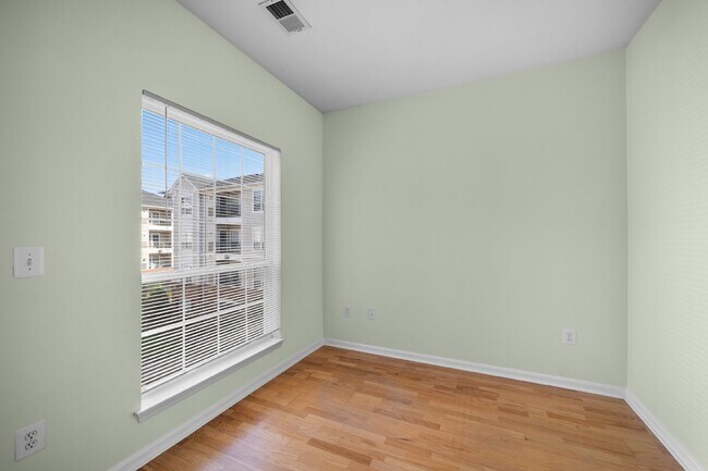 Building Photo - Two-bedroom, two-bathroom model with a den, located on the third floor.