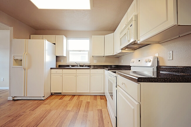 Building Photo - Four bedroom home available soon in NW Minot.