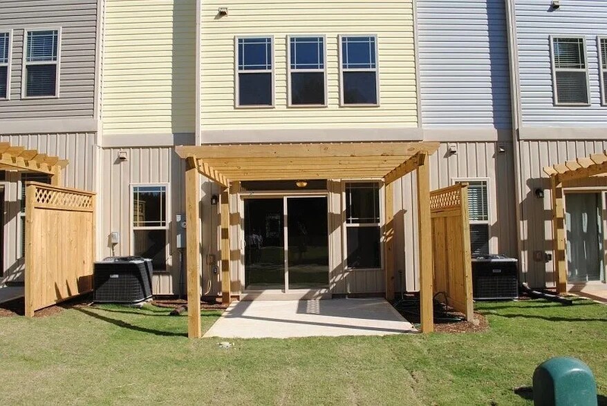 patio backing to common area with a pergola, trees, greenway trails and scenic private pond - 2908 New Hill Park Rd