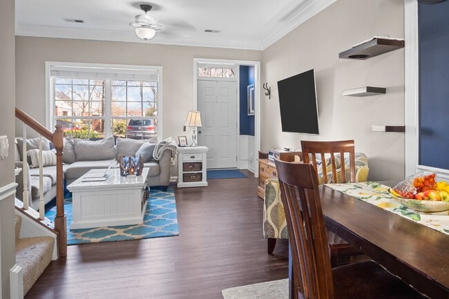 Building Photo - This inviting two-level townhome offers comfort and style, featuring gleaming hardwood floors on ...
