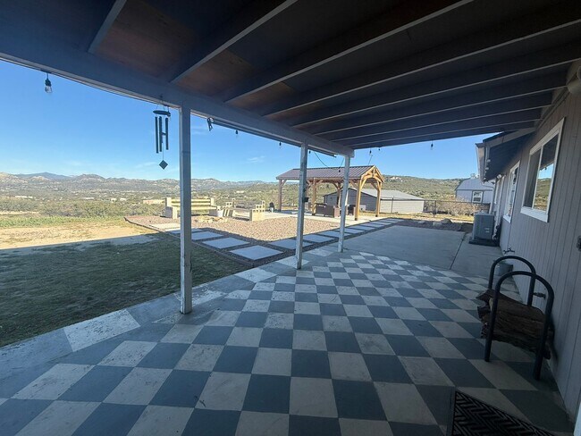 Building Photo - 4BR/2BA HOME w/ attached garage, usable land, fenced in back yard in CAMPO available!