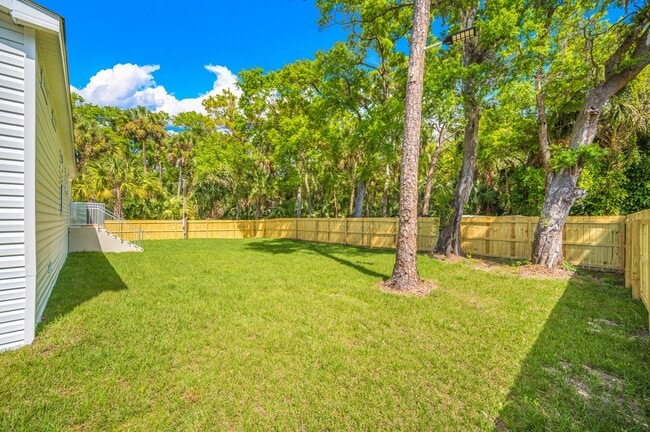 Building Photo - Experience exceptional living at its finest