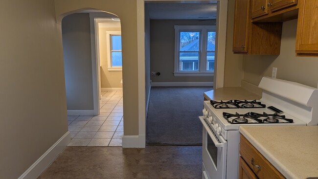 From kitchen looking into Livingroom and BA hallway - 3939 Section Rd