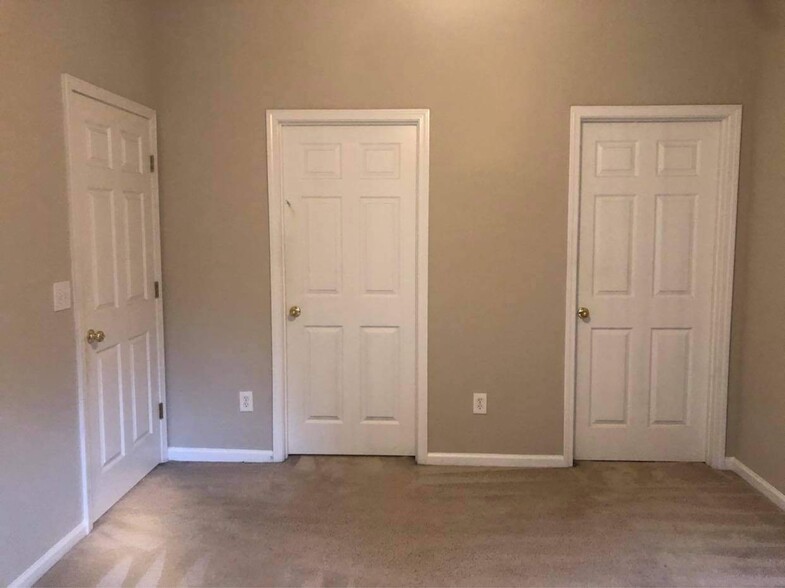 Left door entrance to Master BR, mid door walk in closet, Rt door master Bathroom - 13800 Herons Landing Way