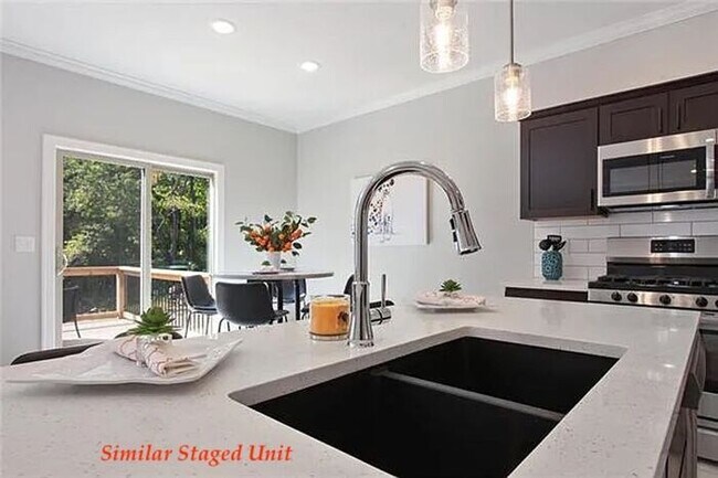 Building Photo - Stunning and Bright 3BR 2.5BA Townhome w/ 2-Car Garage • Quartzite Kitchen • Deck in Parkville