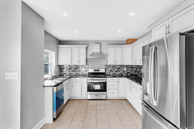 Brand new, never used Stainless Steel General Electric matching appliances adorn the kitchen - 2416 Magee Road Ext