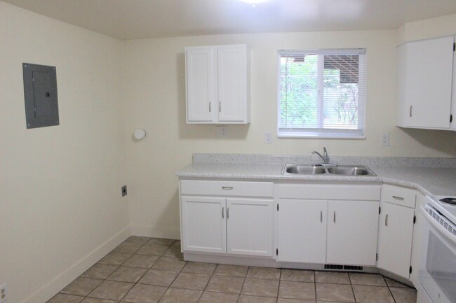 Kitchen and dryer hookup. - 338 E 1600 S