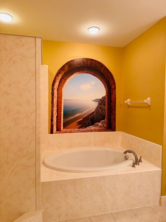 Building Photo - Experience Bell Tower Park. GATED ground floor 2 Bed 2 Bath Den 1 Car Garage Condo.