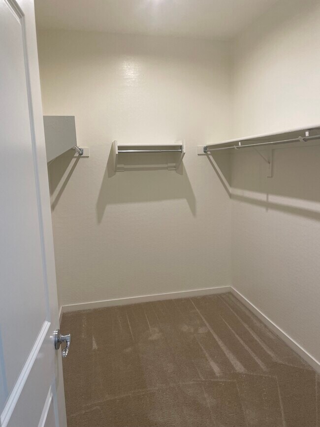 Master bedroom walk in closet. - 2185 S 237th Dr