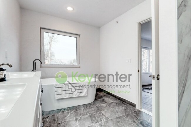 Building Photo - Modern New Construction 3 Bedroom Townhome with Garage & Driveway — First Occupancy!