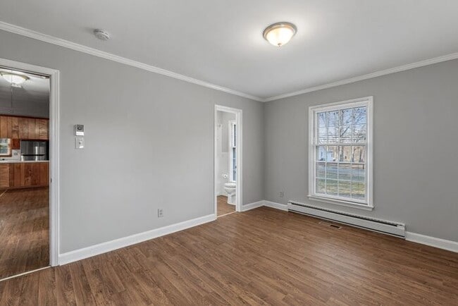 Building Photo - Large Brick Ranch, New Wood Like Flooring Throughout, Just Painted, LR, Den, Sun Room, Carport!