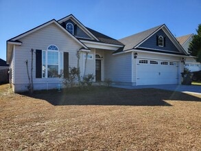 Building Photo - Spacious 4-Bedroom Home with Open Layout, Granite Finishes & Fenced Yard