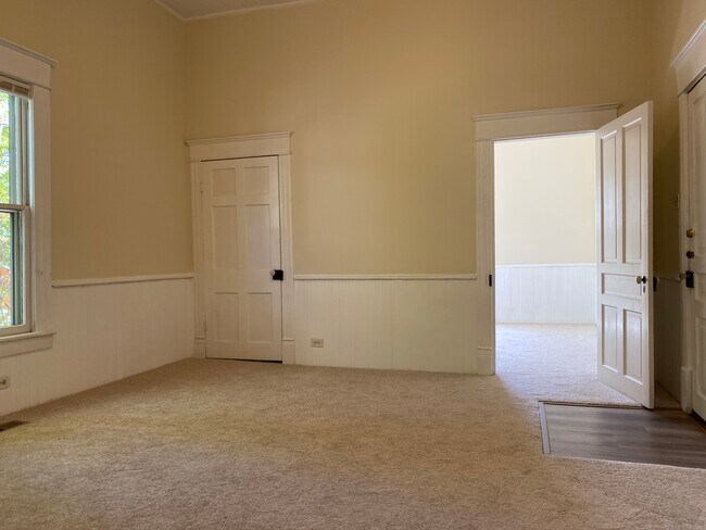 The back porch steps lead down to a lower level space with washer/dryer hookups. - 218 Linden Ave