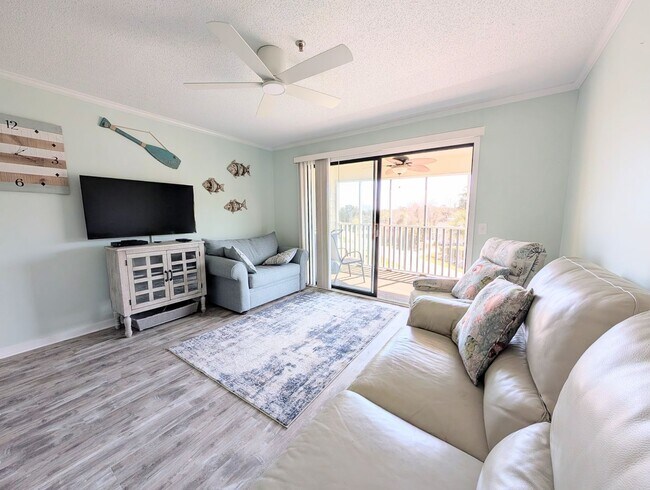 Building Photo - Dreamy Little River Condo — Furnished, Elevator Access, Pool & Marina Nearby!