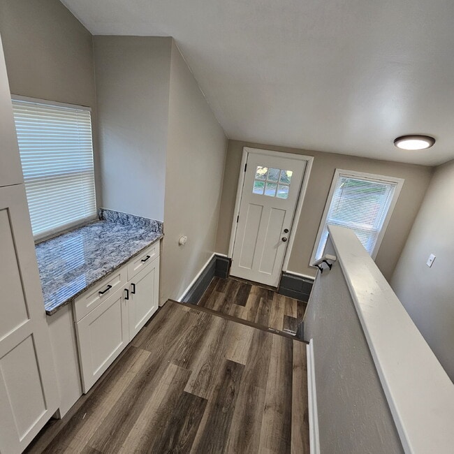 Building Photo - Duplex - 2 Bedroom Completely Remodeled Living Space with New Laminate Flooring on Main Floor alo...