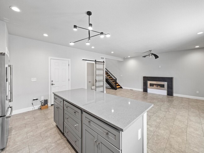 Building Photo - 4-Bedroom Townhome with Finished Basement, Garage & Private Outdoor Space