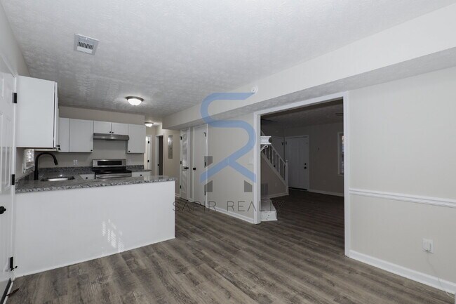 Building Photo - Move in before December 31st and choose your reward: a $250 Amazon Gift Card or a 55" Smart TV!