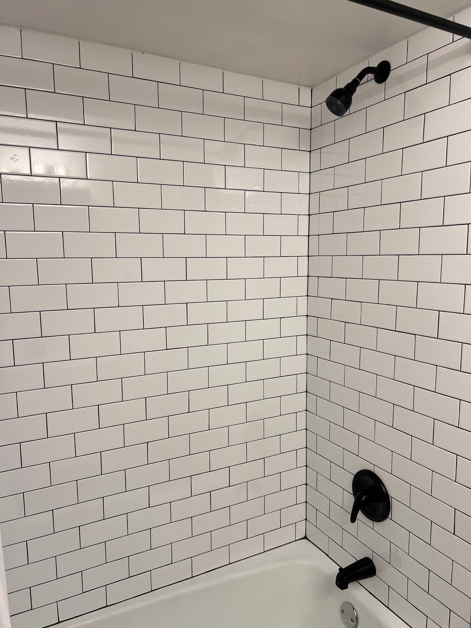 Newly tiled bathtub/shower combo w/ new fixtures - 7220 Madison St