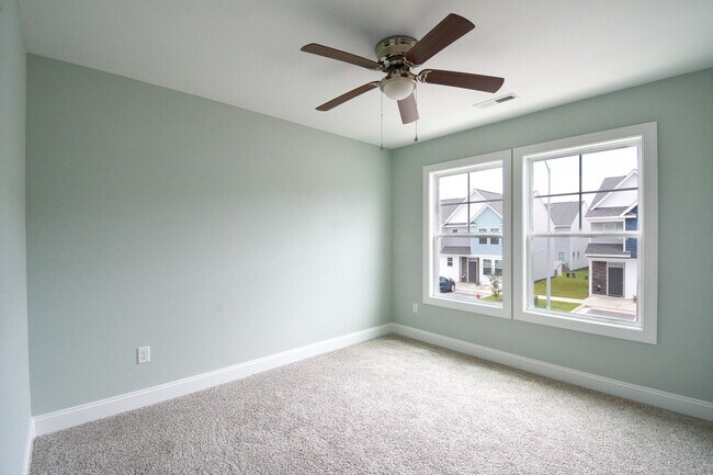 Building Photo - New END UNIT Townhome with Pond View and D...