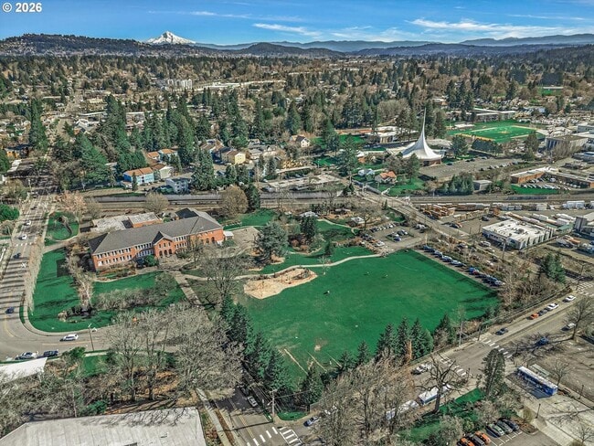 Building Photo - Main Street Living with Granite Kitchen, Gas Fireplace, and MAX Line Access