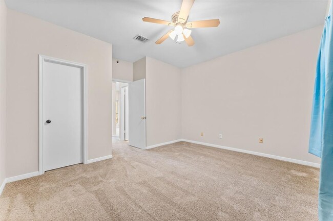 Bedroom with walk-in closet - 3500 Tangle Brush Dr