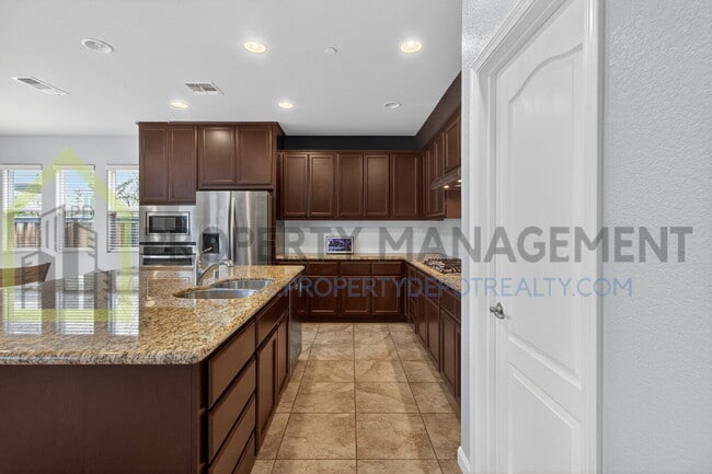 Building Photo - Spacious Elegance Awaits: 4-Bedroom Home with Hardwood Floors in Elk Grove!