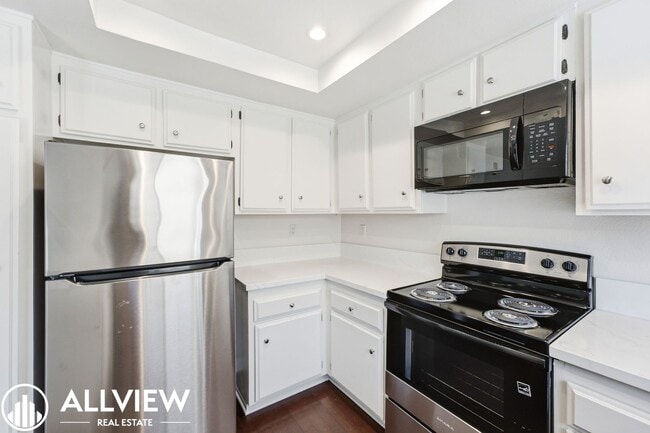 Building Photo - Fully Renovated 2 Bed Townhome with Private Patio, 2-Car Garage & Community Pool