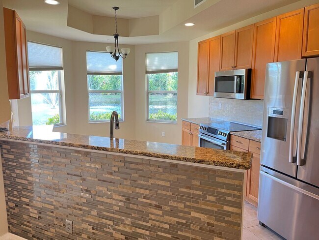 Building Photo - Meadows of Estero 1st floor unit with 2 car garage