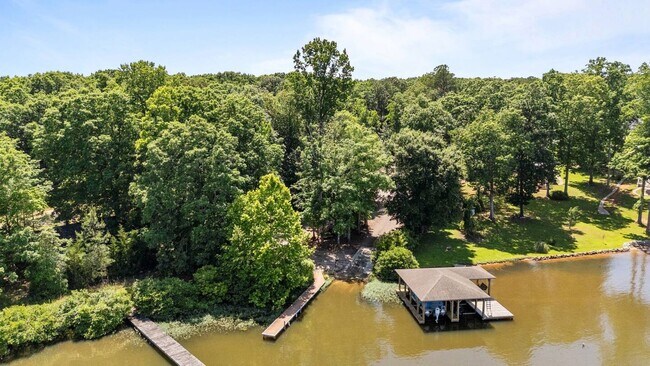Building Photo - This FULLY FURNISHED ALL INCLUSVIE HOME IS...