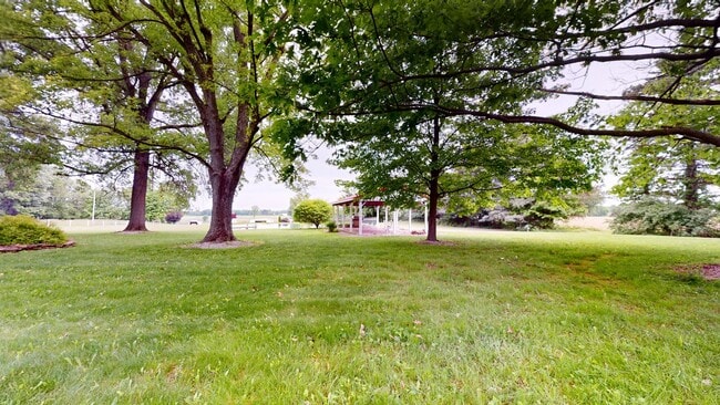 Building Photo - County living with pond & out buildings