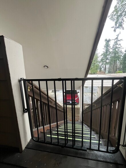 Security gate at top of stairs - 7511 N Edgewater Ave