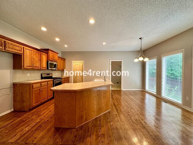 Building Photo - Beautiful Four-Bedroom Home with Three Car...
