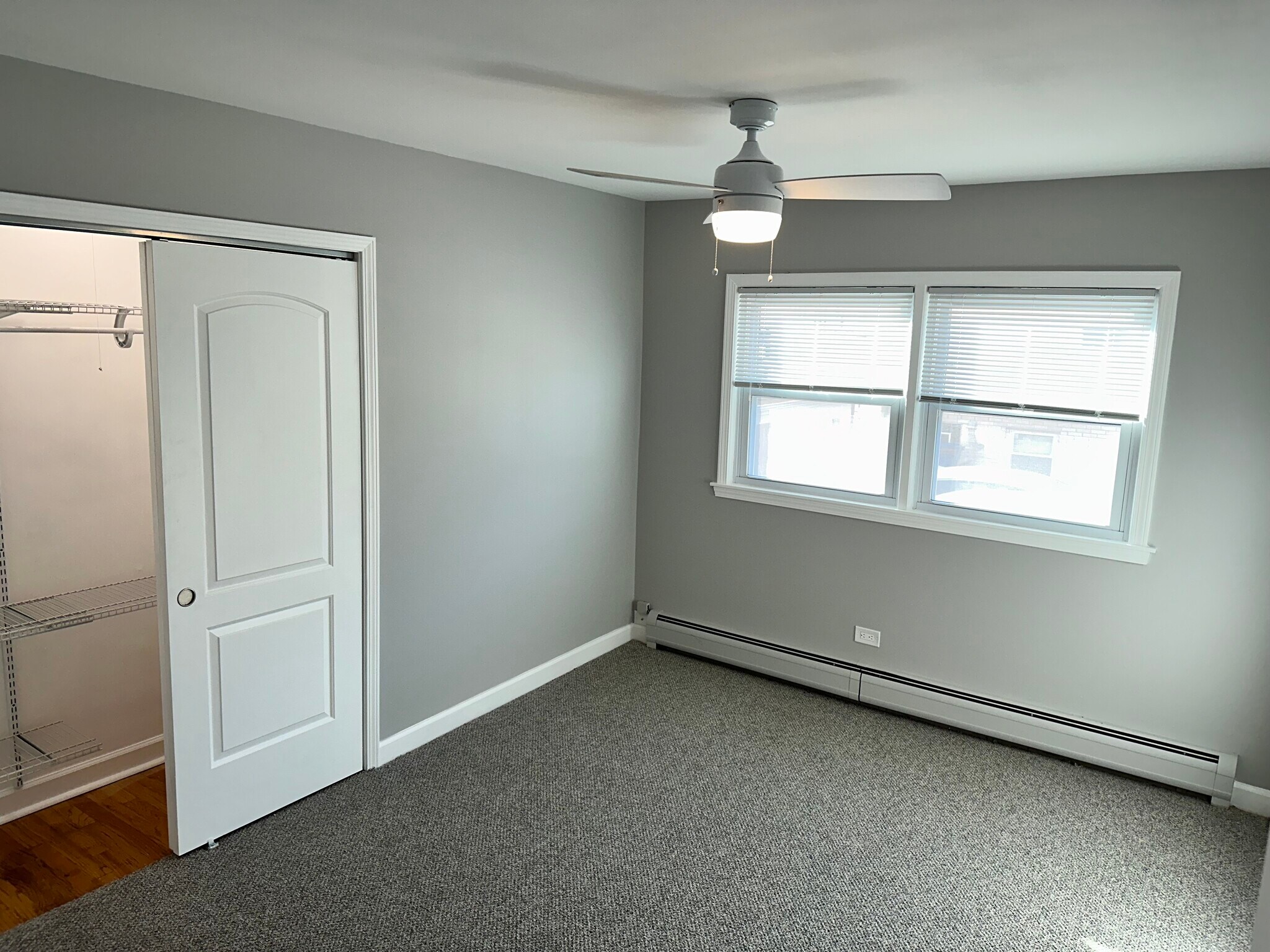 Middle bedroom with closet, new doors, new blinds and carpeting. - 771 56th St