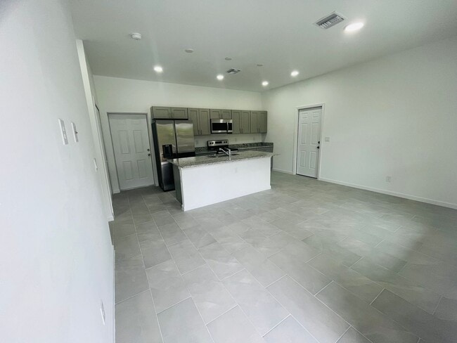 Building Photo - BRAND NEW CONSTRUCTION- ONE OF A KIND-ONE BEDROOM, ONE BATH-ONE CAR GARAGE- LEHIGH ACRES