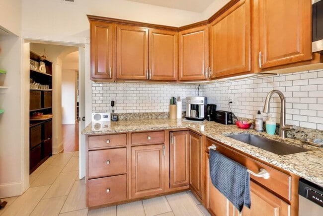 Building Photo - COMING SOON - Sprawling 5 Bed, 3 Bath, Two Kitchens, Dual Back Decks, Two Office/Den Townhouse, 2...