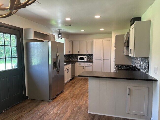 Building Photo - Welcome to country living with a fresh, modern twist.