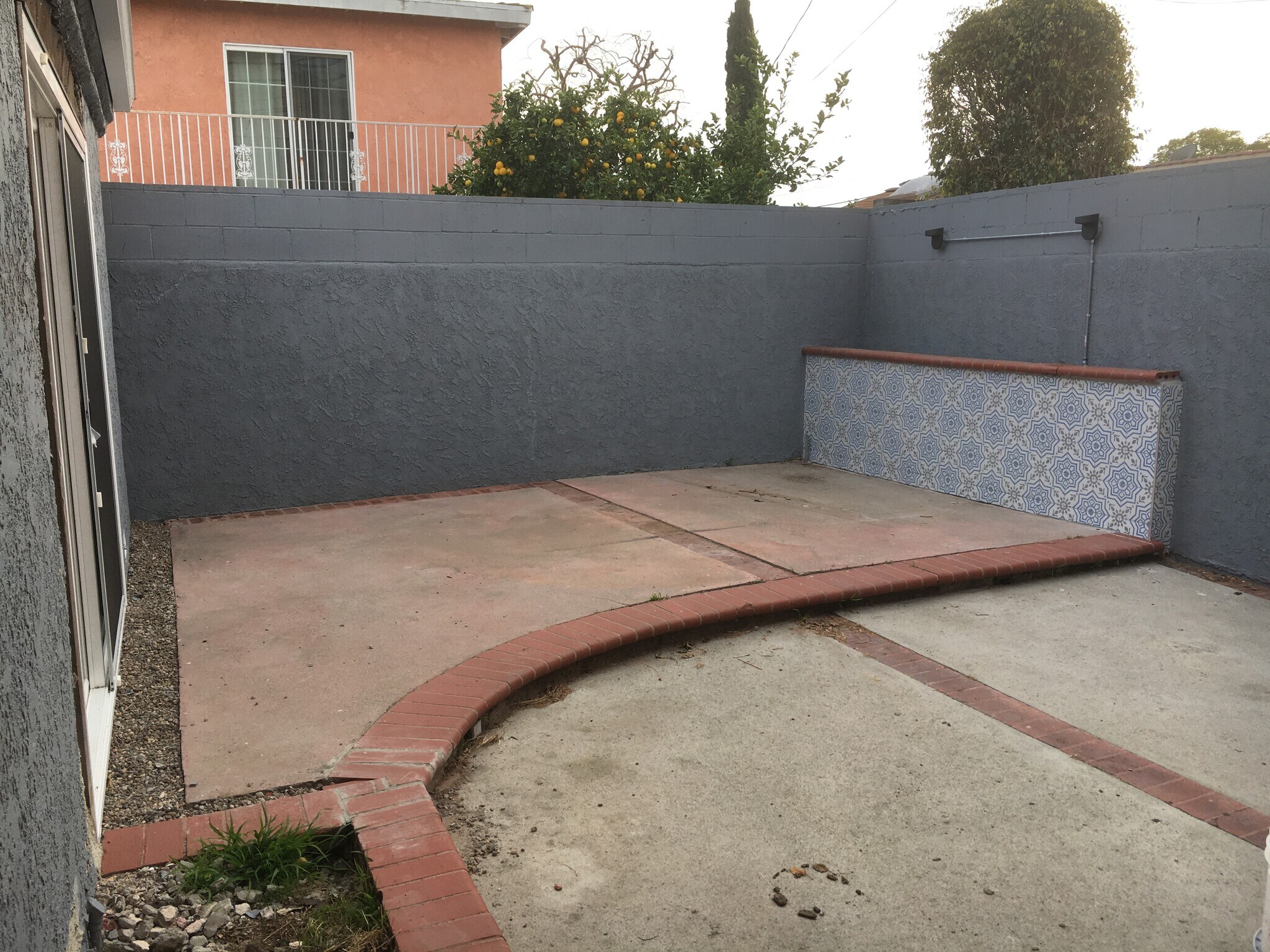 Private back patio between house and garage. - 806 E 65th St