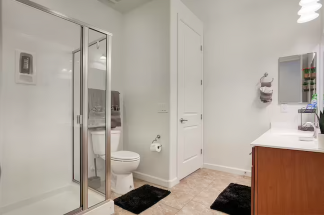 Downstairs Bathroom Next to Downstairs Bedroom & Garage 1 - 5831 W Plum Rd