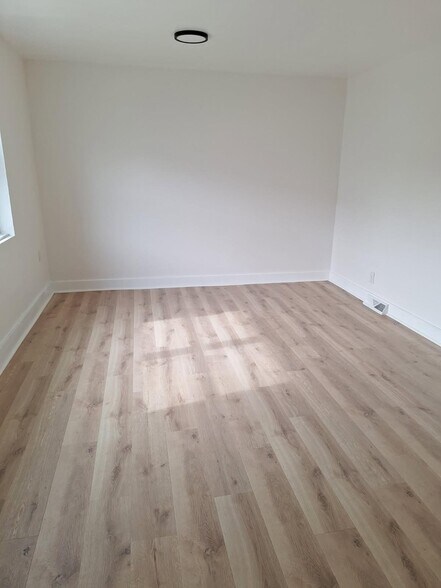 Building Photo - 123-125-125 E 2nd St