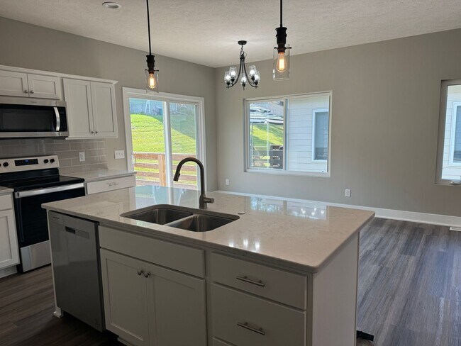 Building Photo - Luxury Bennington Townhome Ready For Move In