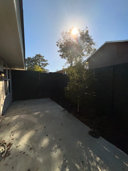 Outside yard with Flower Beds and Security Fence - 324 Saint Thomas Ln